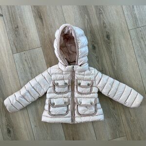 Moncler down pink winter jacket for a girl.